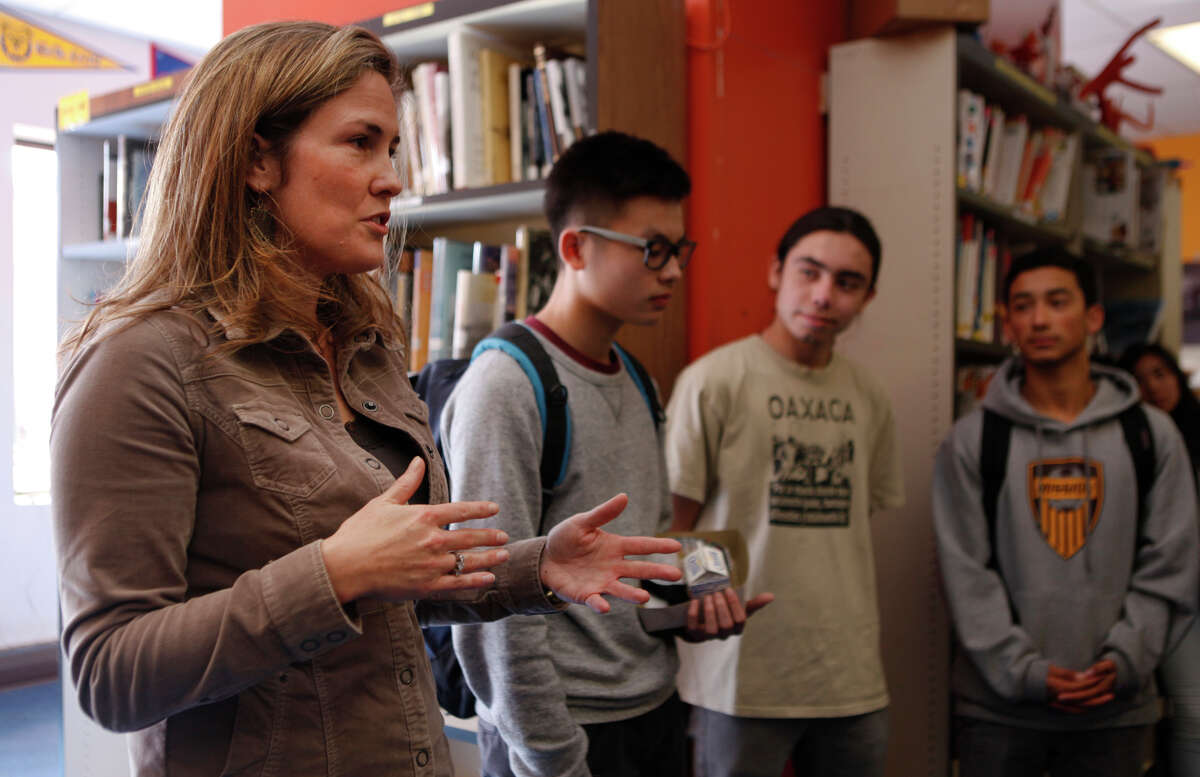 Lindsay Hower, executive director of Summer Search, visits with students at Mission High School in San Francisco. Summer Search received a $500,000 grant from the Super Bowl host committee’s charity arm.