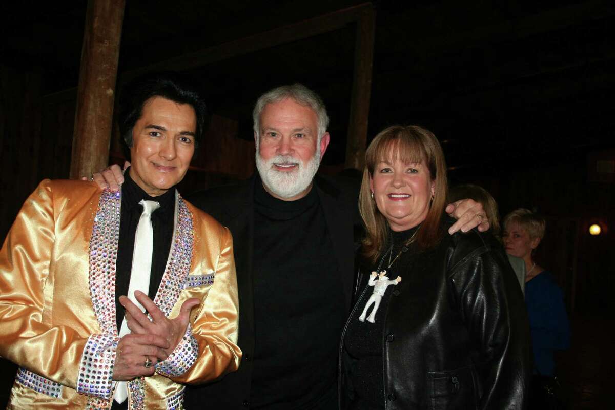 Boys Choir Founder and Executive Director Bill Adams, center, greeted Elvis impersonator Ralph Elizondo, left, and former board president Dianne Wilson to the gala. Wilson wore an Elvis necklace she picked up at Graceland.
