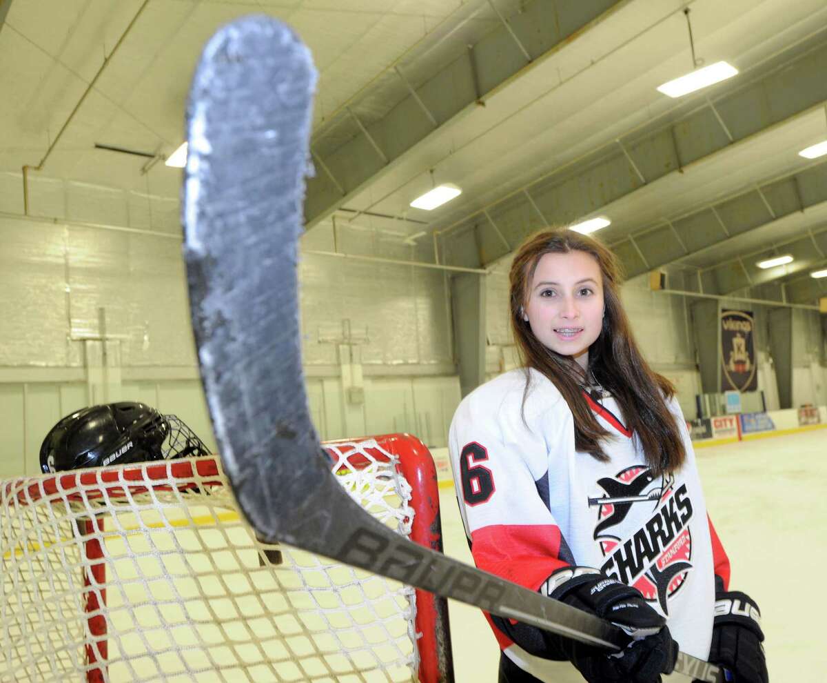 Mary Leydon, 13, a member of the Sharks ice hockey team, works out at the Twin Rinks in Stamford, Conn., Tuesday, Jan. 13, 2015. Leydon, a Cloonan Middle School 8th grader, plays hockey in an age bracket where checking is permitted. Leydon said she is a N.Y. Ranger hockey fan.