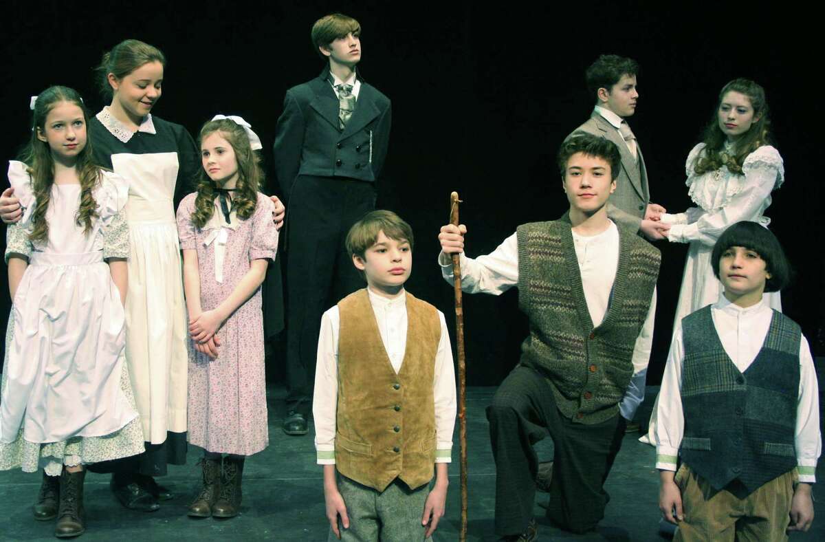 Among those rehearsing for New Milford High School's all-school musical presentation of "The Secret Garden" are, from left to right,Jenna Epstein, Abby Myhill and Samantha Learson; left background, Kellen Ness; right foreground, Collin Larson, Liam Pitt and Ian McNulty; and, right background, Tony Harkin and Cassie Bielmeier. March 2015 Courtesy of New Milford High School