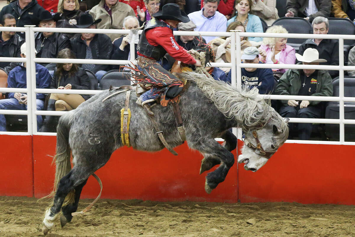 Rusty Wright, from Milford, Utah, competes in the saddle bronc riding event during the finals of the San Antonio Stock Show & Rodeo at the AT&T Center on Feb. 28, 2015. Wright scored an 87 on his ride to take first place in the event.