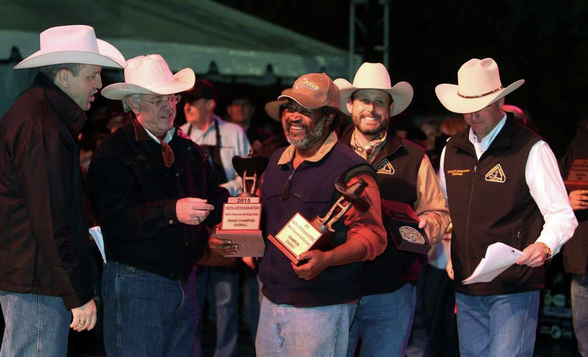 "Across the Track Cook-Off Team" is awarded the Grand Champion Overall winner for the 2015 Houston Livestock Show and Rodeo World's Champion Bar-B-Que Cookoff and representative Kerry Fellows receives the award on Saturday, Feb. 28, 2015, in Houston.