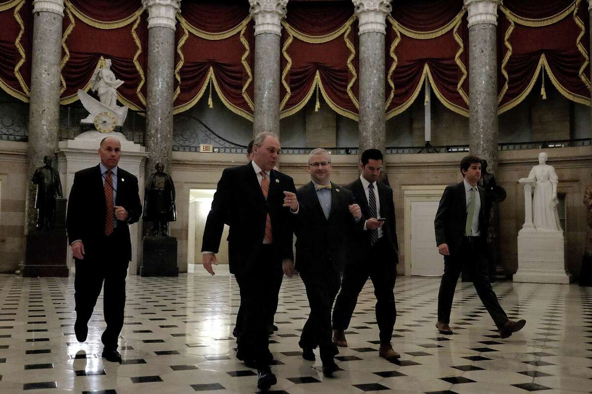 WASHINGTON, DC - FEBRUARY 27: House Majority Whip Rep. Steve Scalise (R-LA), second from left, walks with Deputy Whip Rep. Patrick McHenry (R-NC), at center, on their way to the House chamber to vote on a stopgap spending bill to fund the Department of Homeland Security at the U.S. Capitol on February 27, 2015 in Washington, DC. The last-minute deal will fund DHS for one week, prolonging the debate over long-term funding for the department. (Photo by T.J. Kirkpatrick/Getty Images)