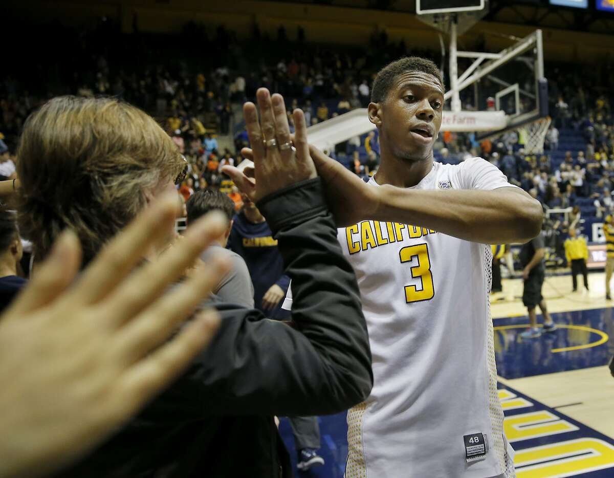 The Bears Tyrone Wallace (3) got a high five from happy fans at the end of the game. The California Bears men's basketball team defeated the Oregon State Beavers 73-56 at Haas Pavilion in Berkeley, Calif. Sunday March 1, 2015.