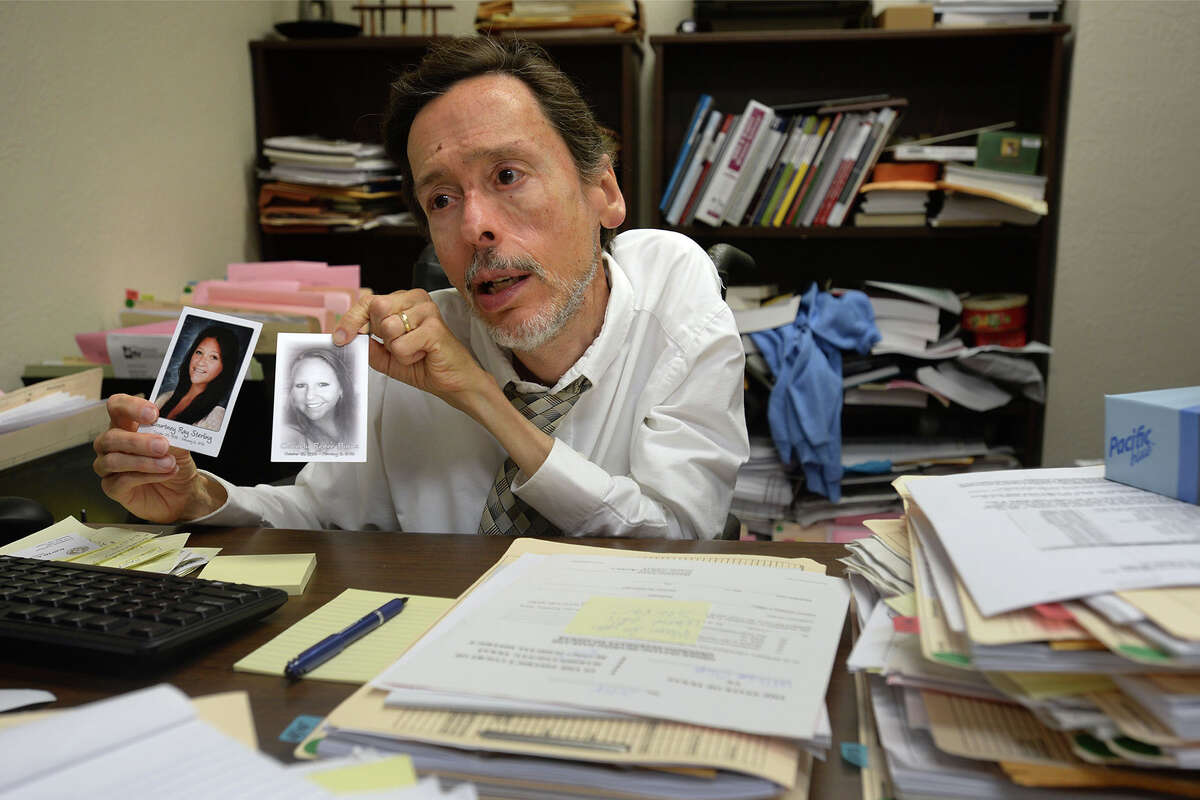 David Sheffield holds up pictures of Connely Burns, right, and Courtney Sterling at his office on Thursday. Shuffield says he keeps the pictures on his desk to remind of his task as a Hardin County's District Attorney. The two girls were killed in a 2014 auto accident. Photo taken Thursday, February 20, 2015 Guiseppe Barranco/The Enterprise