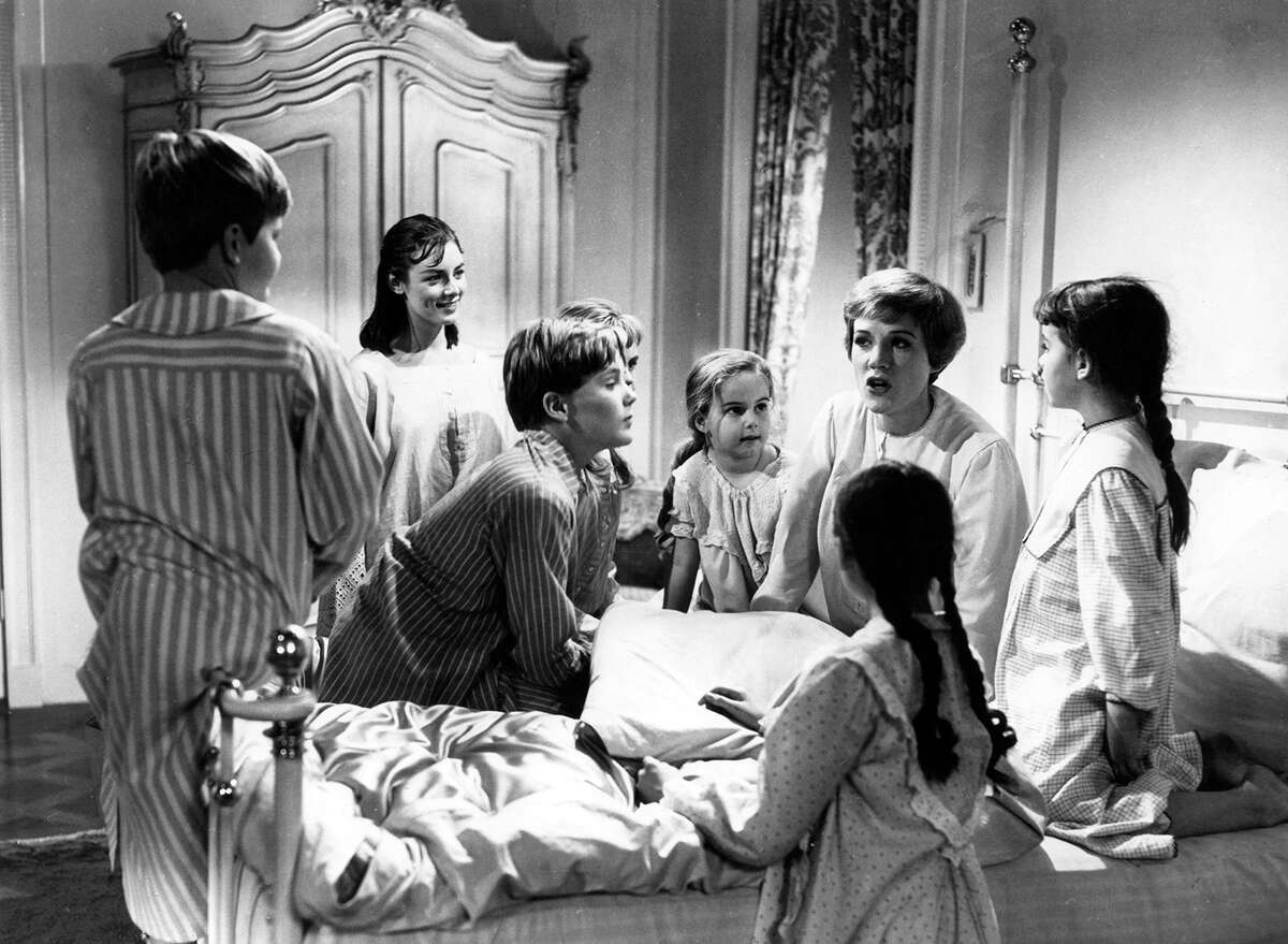 Julie Andrews sings about raindrops on roses, among other favorite things, to the Von Trapp children in a scene from the film "The Sound Of Music," 1965. The film tells the story of a young woman who leaves a convent to become the caretaker for seven children in Austria.