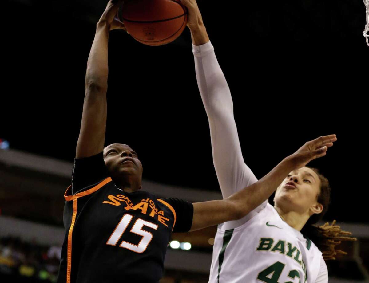 Oklahoma State forward Toni Young (15) has her shot blocked by Baylor center Brittney Griner (42) in the second half of a game in the Big 12 women’s tournament on March 10, 2013, in Dallas.