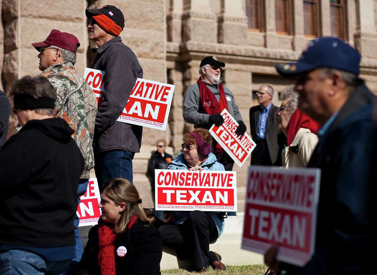 AUSTIN, TX- JANUARY 11: People belonging to the Tea Party movement convene at a rally at the Texas state capitol during the first day of the 82nd Legislative session on January 11, 2011 in Austin, Texas. The demonstrators picketed demanding true conservative values from elected officials.