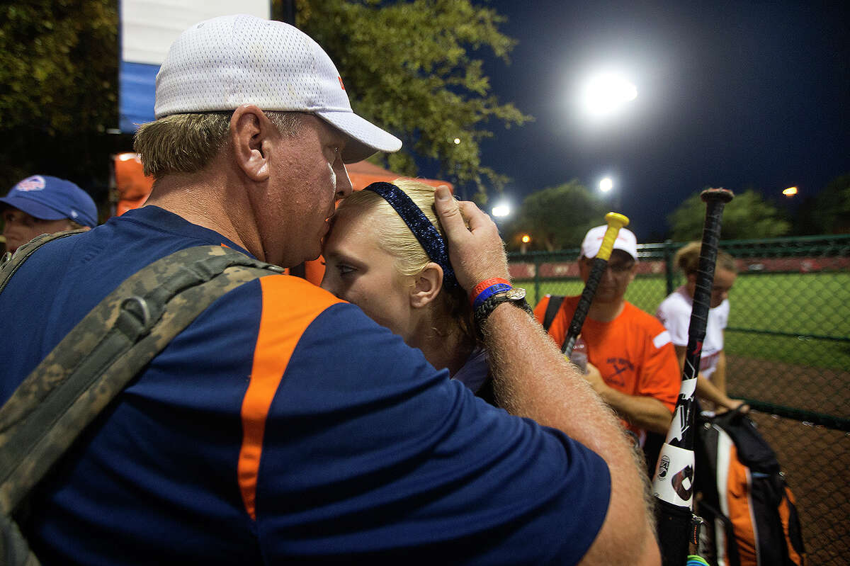 KISSIMMEE, FL - AUGUST 1:Mass Drifters Coach Curt Schilling, right, kisses his daughter, Gabby, after two come-from-behind victories during a USSA Girls Fastpitch World Series II. (Photo by Stan Grossfeld/The Boston Globe via Getty Images)