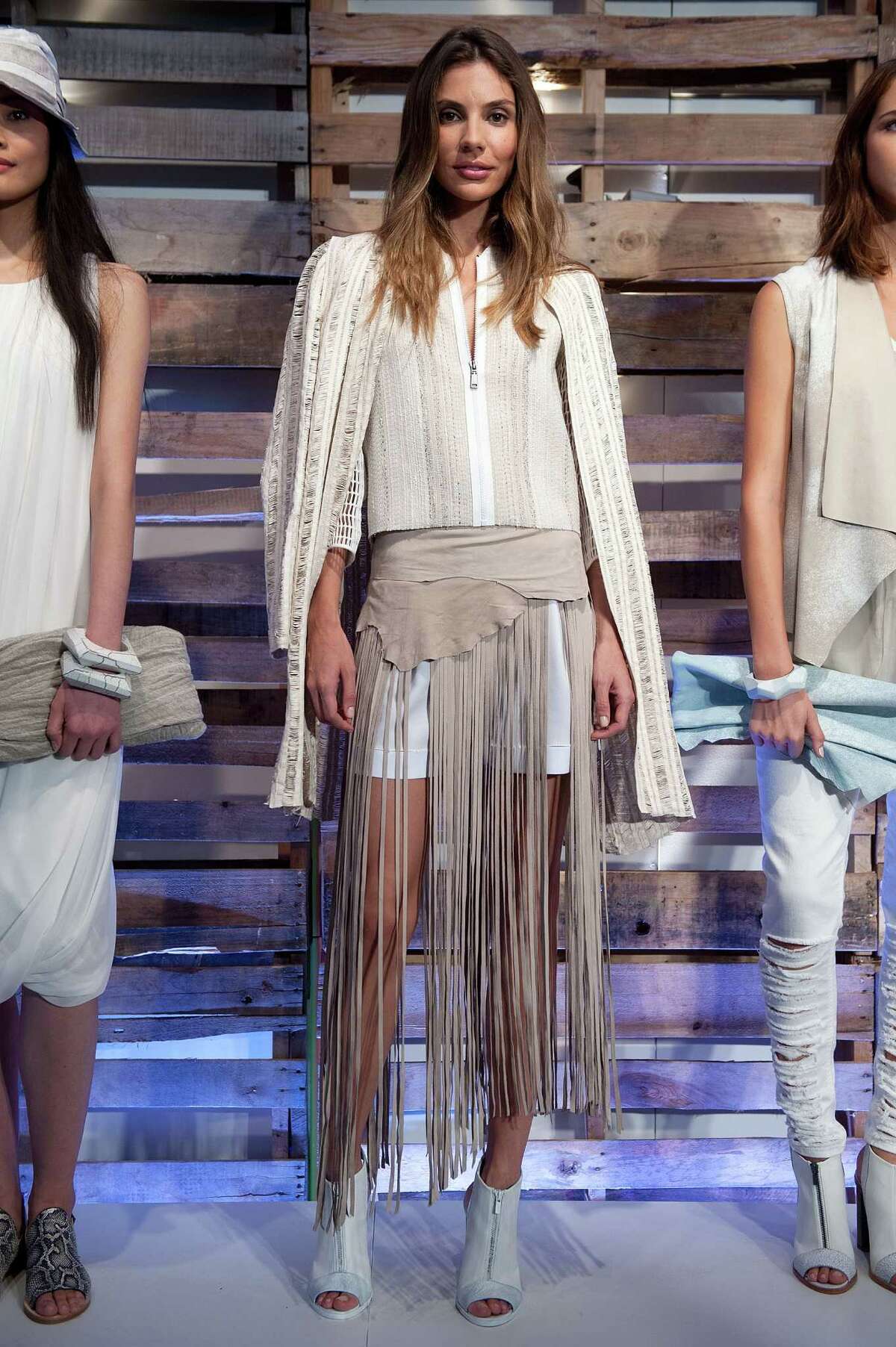 Fringe on a variety of garments and accessories will be trending for spring 2015 trend as seen in this look from Elie Tahari.