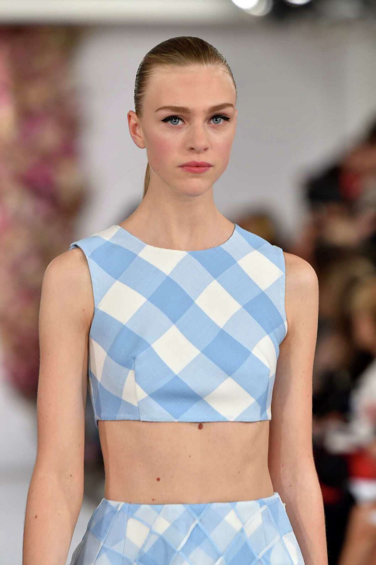Gingham is predicted to be the print of the spring season in dresses, skirts, tops, jackets and long coats as seen in this look from Oscar de la Renta.