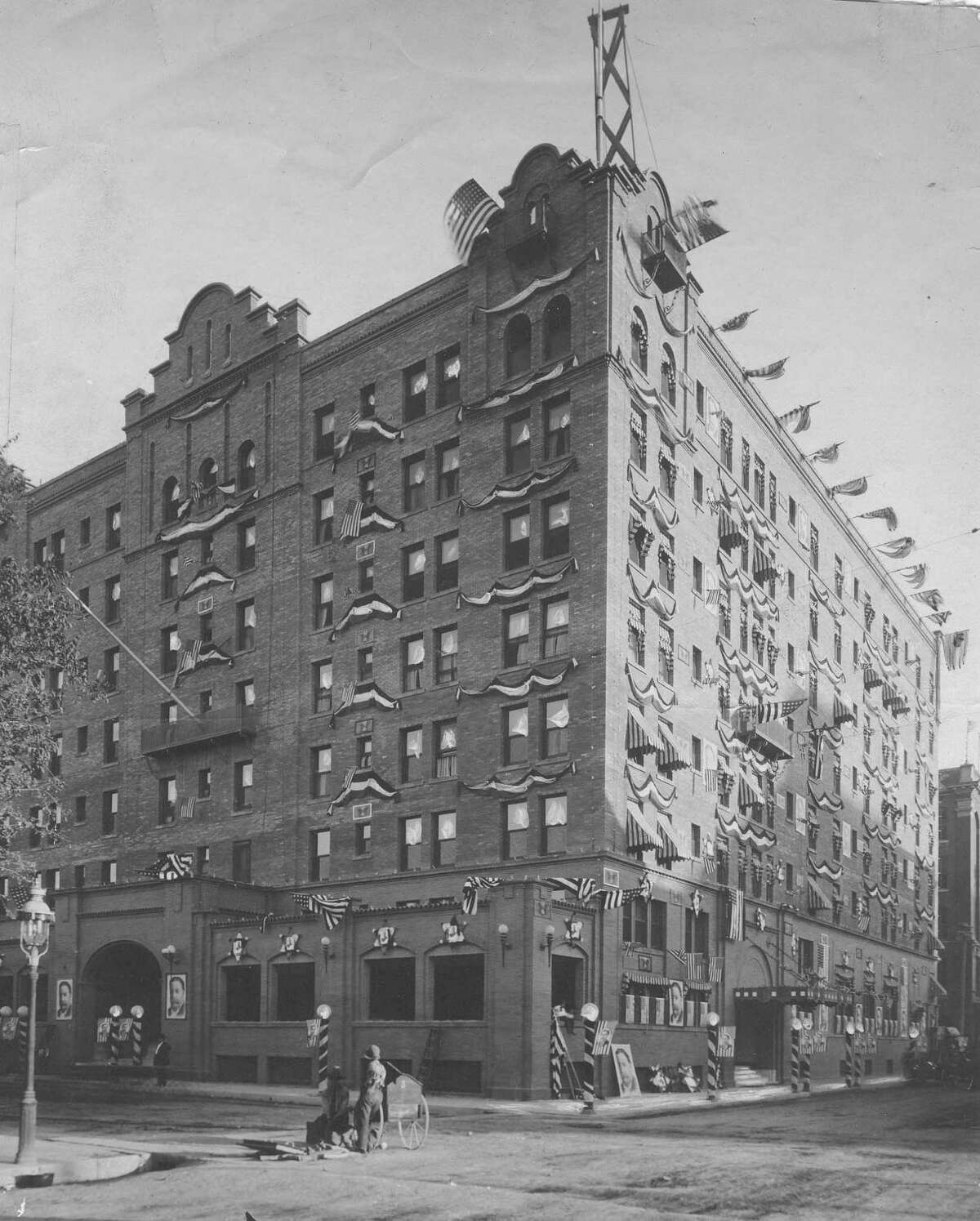 The St. Anthony Hotel is shown decked out in flags, bunting and pictures of President William Howard Taft in celebration of his visit to San Antonio on Oct. 17, 1909. Taft stayed at the hotel. Published in the Express, October 17, 1909.