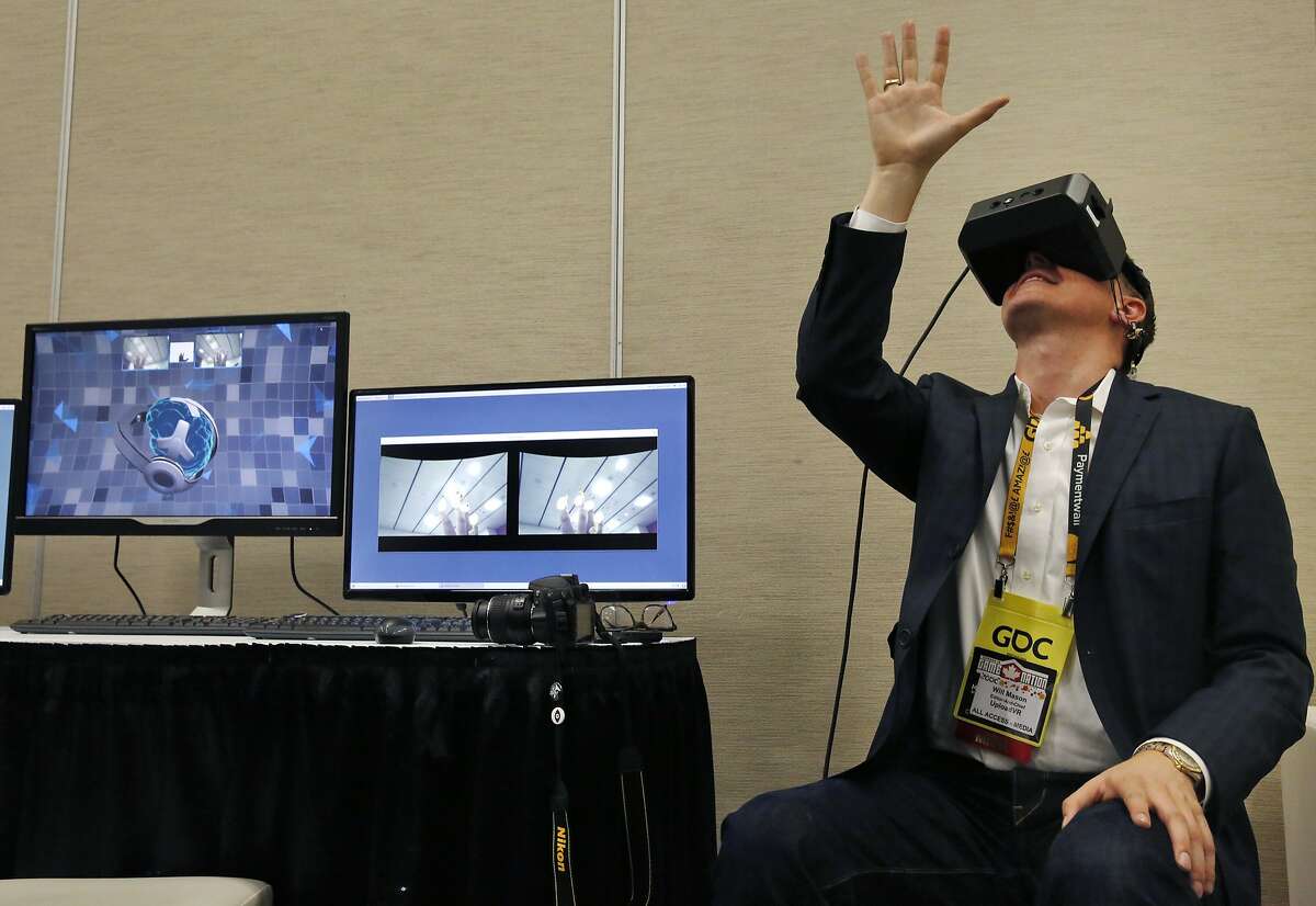 Will Mason with Upload VR, tries out the new MindLeap neurogoggles during the Game Developers Conference at Moscone Center South March 3, 2015 in San Francisco, Calif.