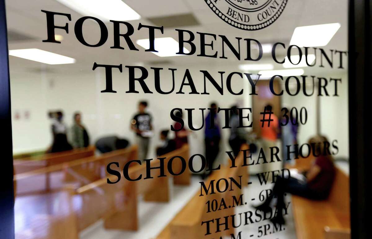 Juveniles form a line to enter the Fort Bend County Truancy Court Tuesday, March 3, 2015, in Sugar Land, Texas.