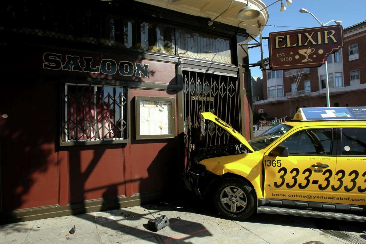 The scene of a collision between a four-door silver Mazda 3 and a yellow cab, which then crashed into the Elixir bar at the corner of 16th and Guerrero Street, Wednesday, March 4, 2015, in San Francisco, Calif.