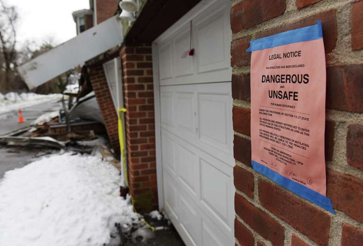 A garage collapsed due to the weight of snow atop the structure in the Putnam Park Apartments complex in Greenwich, Conn. on Wednesday, March 4, 2015. Nobody was injured in the collapse, but four vehicles were damaged and stuck inside the garage.