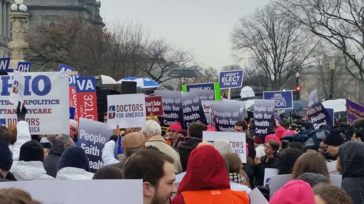 Supporters and opponents of the Affordable Care Act and its federal subsidies rally Wednesday in Washington D.C. as the Supreme Court hears oral arguments in King v Burwell, rthe lawsuit challenging the subsidies in the federal health insurance marketplace. (Claudette Newsome)