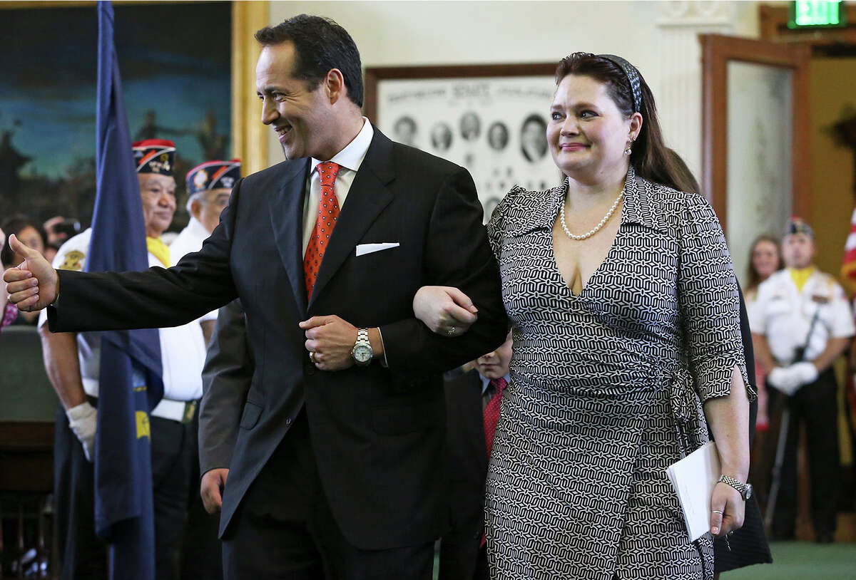 Jose Menendez walks into the Senate with his wife Cehlia Newman-Menendez to be sworn in by Orlando Garcia, U.S. District Judge from San Antonio at a special ceremony in the Senate at the Capitol in Austin on March 4, 2015.