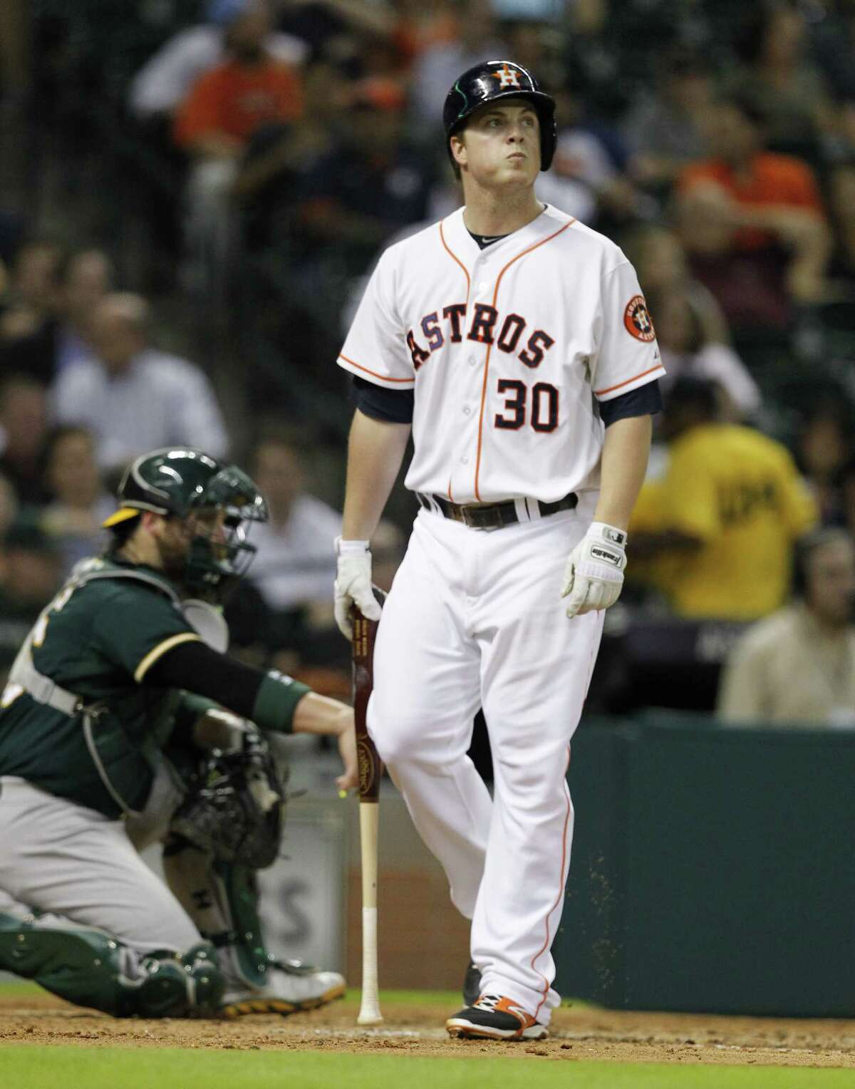 HOUSTON, TX - AUGUST 27: Matt Dominguez #30 of the Houston Astros walks from the plate after striking out in the fourth inning against the Oakland Athletics at Minute Maid Park on August 27, 2014 in Houston, Texas. (Photo by Bob Levey/Getty Images)