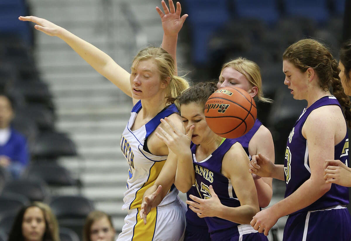 Nazareth's Deborah VanDijk goes for the ball against D'Hanis' Sarah Craft during the second half of the girl's 1A State Semifinals at the Alamodome, Thursday, March 5, 2015. Nazareth won, 61-18 to advance to the state finals on Saturday.