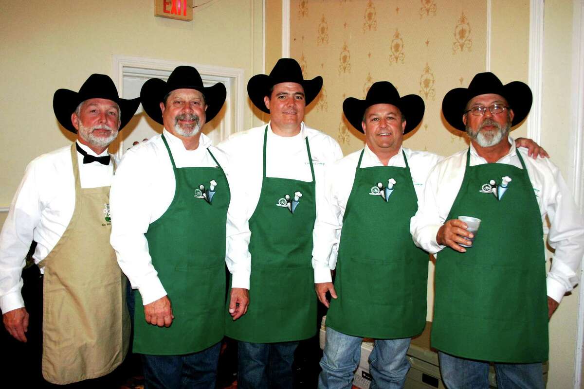 The Culinary Cowboys were among the most visited booths, offering beef brisket. From left are Brad Bowman, Bill Autrey, Chase Raska, Bubba Blasingame, and George Henry Lewis. Their snappy Western attire attracted lots of attention.