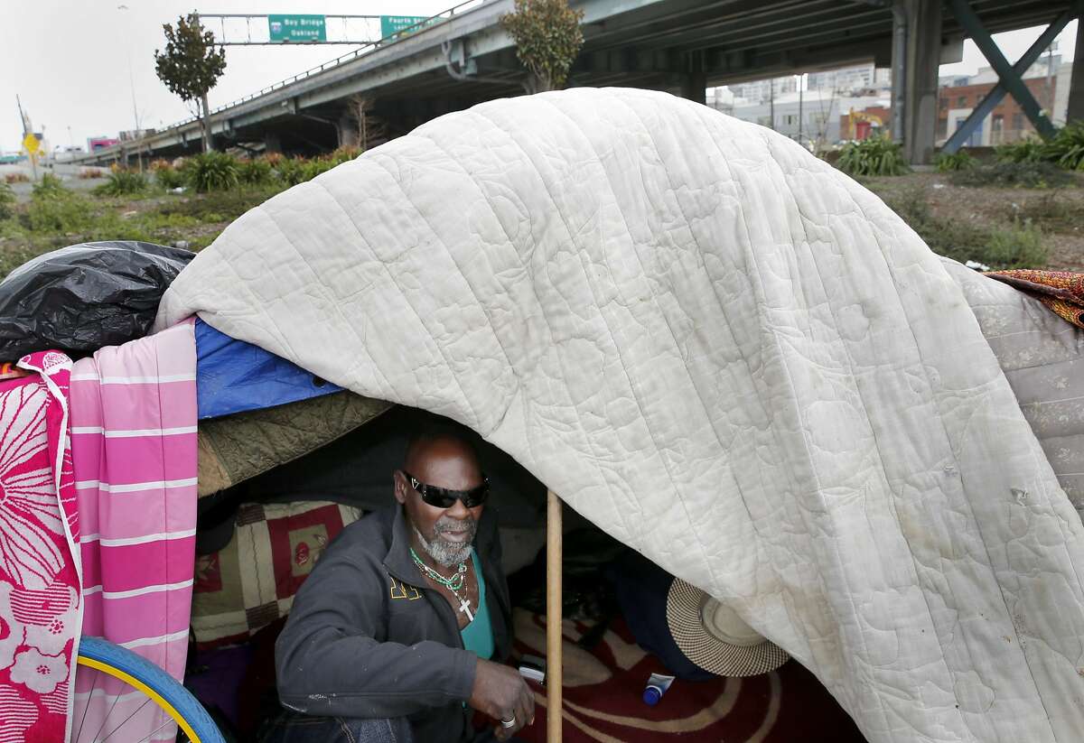 Mo, a homeless man who lives at the encampment in the plaza area near the 5th Street onramp to the Bay Bridge, says he has been here too long Monday March 2, 2015. Homeless encampments are still prevalent in San Francisco, Calif. and their locations are becoming more apparent.
