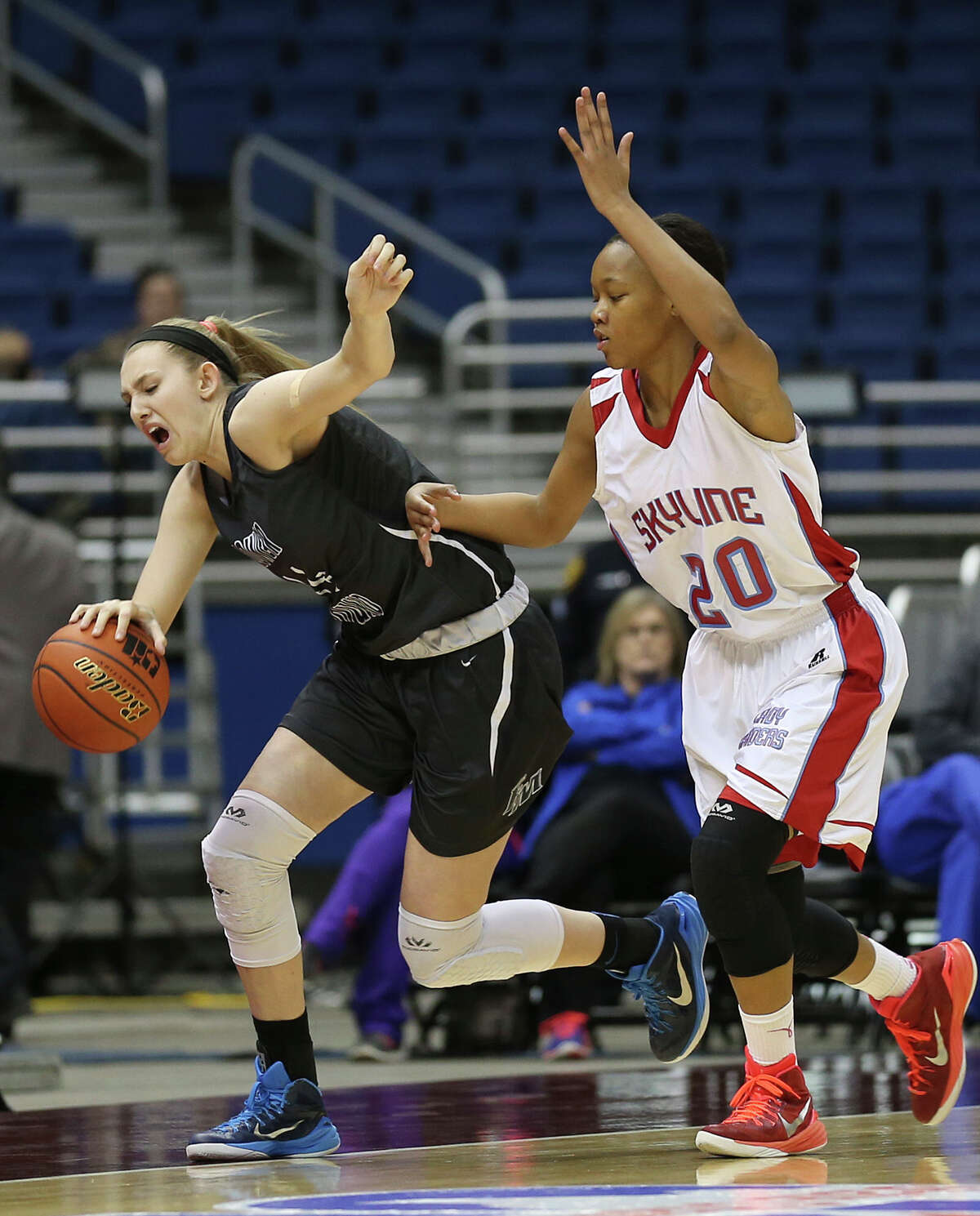 Lewisville Flower Mound's Lauren Cox drives the ball under pressure from Dallas Skyline's Dai'Ja Thomas during the first half of the UIL Girls Basketball State 6A semifinals at the Alamodome, Friday, March 6, 2015. This is the first time the event is in San Antonio, and the first time in more than 90 years it's not being held in Austin.