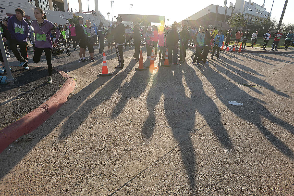 Half and full marathoners await the start during the sixth annual Exygon and Baptist Hospitals Gusher Marathon Saturday in Beaumont. Photo taken Saturday, March 7, 2015 Kim Brent/The Enterprise
