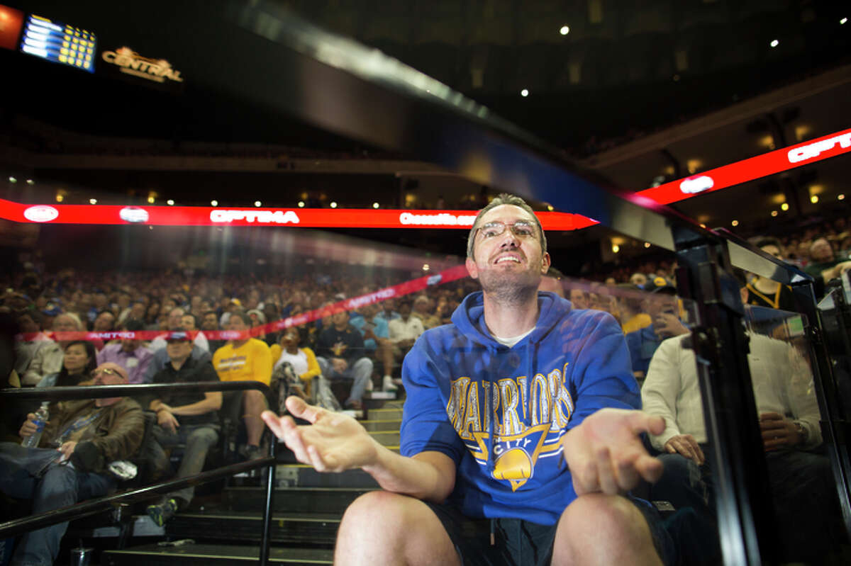 Weston Stankowski, of San Francisco, reacts as the Golden State Warriors play the Dallas Mavericks at the Oracle Arena in Oakland, Calif. on Friday, March 6, 2015.