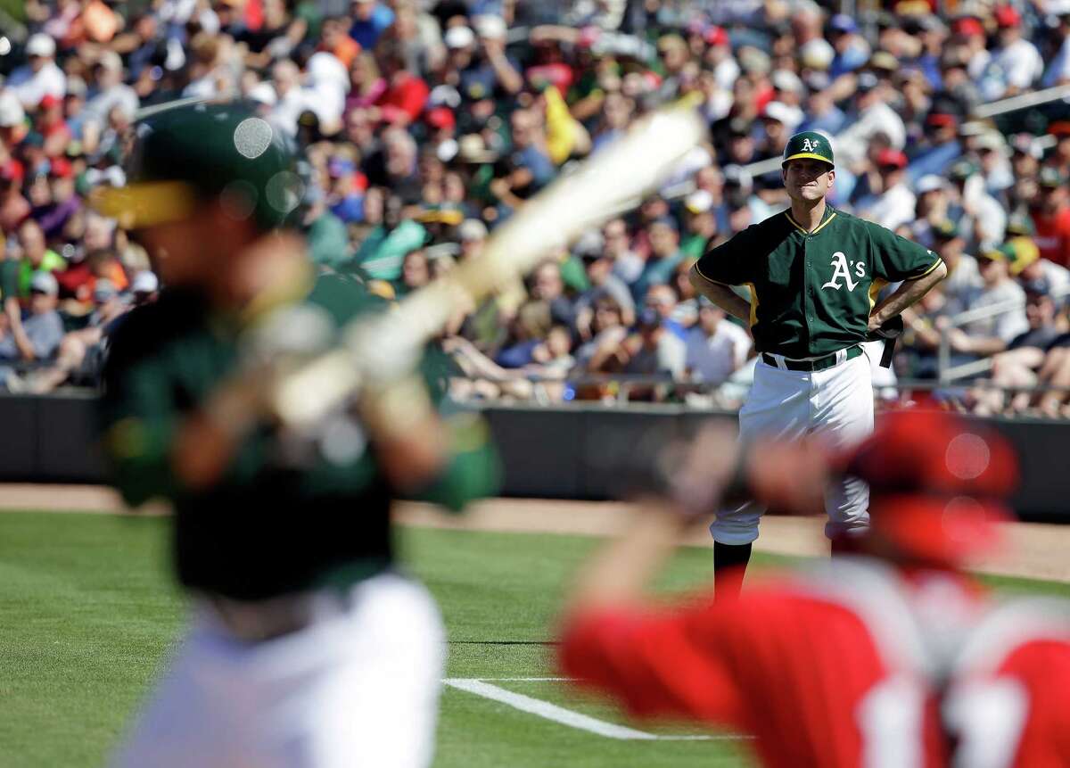 Jim Harbaugh suits up as A’s 1stbase coach