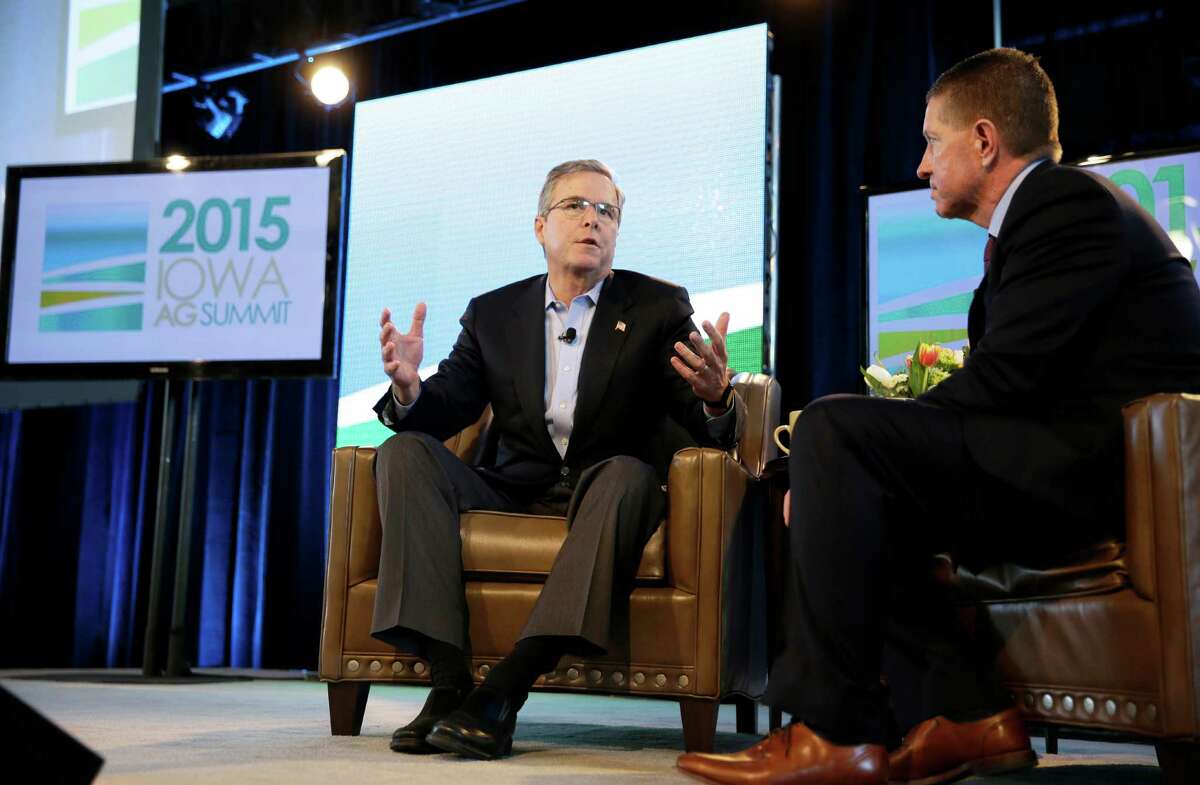Former Florida Gov. Jeb Bush is interviewed by host Bruce Rastetter, right, during the Iowa Agriculture Summit, Saturday, March 7, 2015, in Des Moines, Iowa. (AP Photo/Charlie Neibergall)
