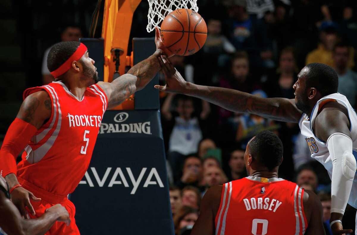 Rockets forward Josh Smith, left, and the Nuggets' J.J. Hickson battle for a rebound during the Rockets' 114-100 win Saturday night in Denver.