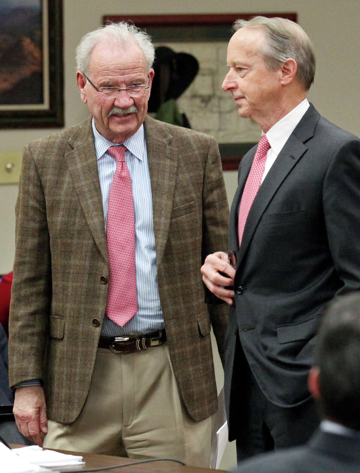 Former Mayor Phil Hardberger (left) talks with Tom Benson's lawyer David Beck Monday Feb. 9, 2015 in Bexar County Probate Court. Bexar County Probate Judge Tom Rickhoff appointed former Mayor Phil Hardberger and estate planning lawyer Art Bayern as co-receivers of Tom Benson's late wife's trust, which owns a 97 percent interest in Lone Star Capital Bank of San Antonio, three car dealerships and a 2,300-acre ranch near Johnson City. 