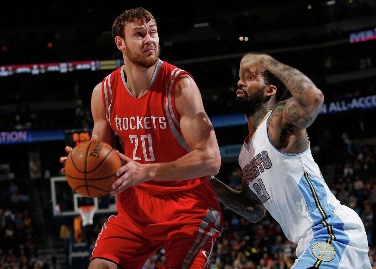 Donatas Motiejunas, left, broke out of a mini-slump Saturday night against Wilson Chandler and the Nuggets.