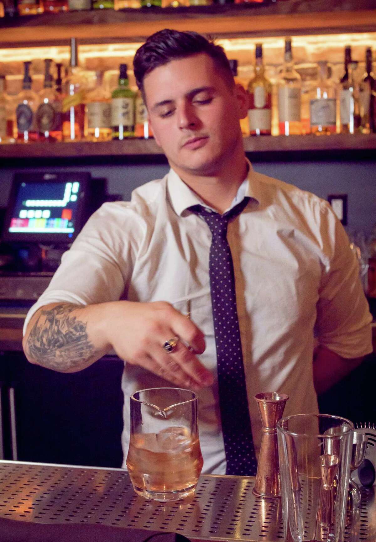 Bartender Anthony Keels makes the Baccarat, with reposado Tequila, a quinine liqueur and a fortified rose wine, at Verbena on Polk Street in San Francisco.