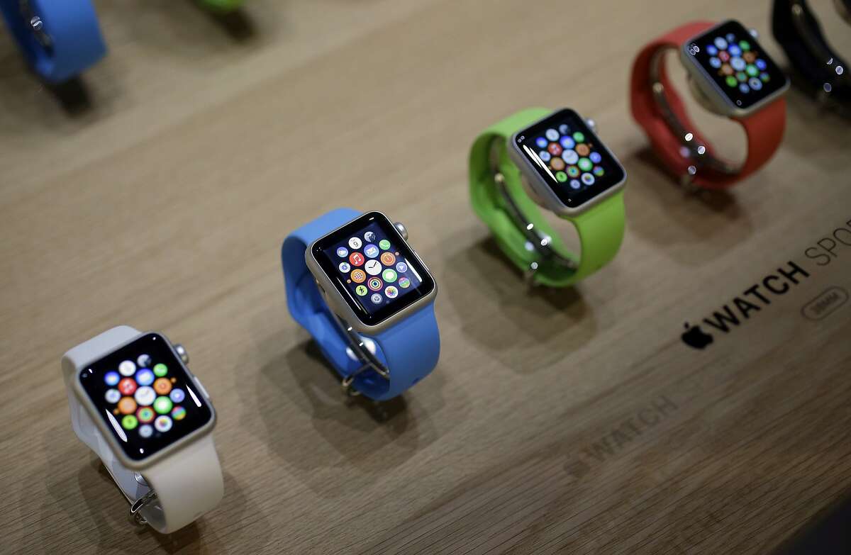 Varieties of the new Apple Watch are on display in the demo room after an Apple event on Monday, March 9, 2015, in San Francisco. Pre-orders for the Apple Watch start April 10. The device costs $349 for a base model, while a luxury gold version will go for $10,000. (AP Photo/Eric Risberg)