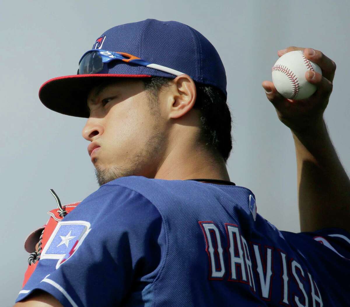Texas Rangers pitcher Yu Darvish throws during spring training baseball practice in Surprise, Ariz., on Feb. 22, 2015. It appears the Rangers, so injury plagued a year ago, will be without staff ace Darvish this season.