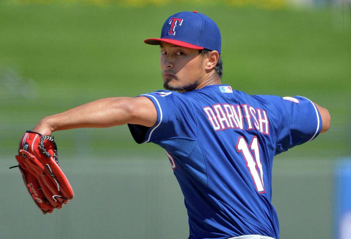 Texas Rangers pitcher Yu Darvish pitches against the Kansas City Royals in Cactus League action at Surprise Stadium in Surprise, Ariz., on March 5, 2015.