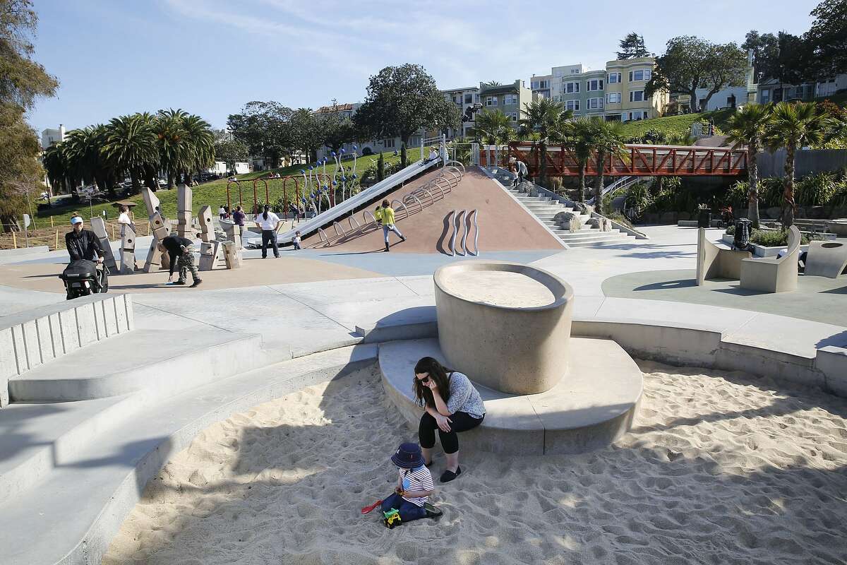 Sebastian Berle-Smith, 2 years old, plays at the sandbox with new sand in the children's playground at Dolores Park in San Francisco, California on Monday, March 9, 2015. Twenty tons of sand replaced polluted sand by vandals breaking bottles a few weeks ago.