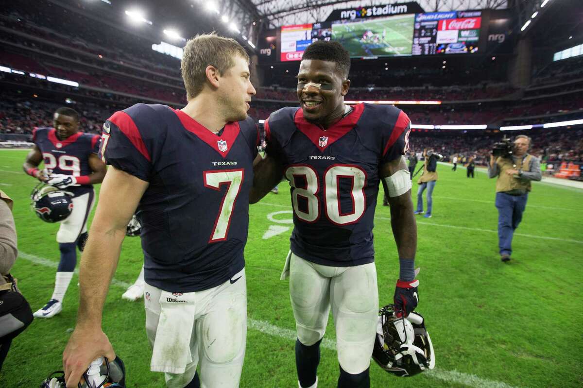 Houston Texans quarterback Case Keenum (7) and wide receiver Andre Johnson (80) walk off the field together after the Texans 23-17 win over the Jacksonville Jaguars at NRG Stadium on Sunday, Dec. 28, 2014, in Houston. ( Brett Coomer / Houston Chronicle )