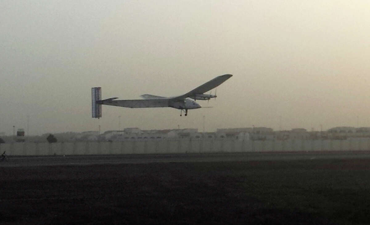 The Solar Impulse 2 takes off at an airport in Abu Dhabi, United Arab Emirates, early Monday, marking the start of the first attempt to fly around the world, some 21,700 miles, using only sunlight as fuel.