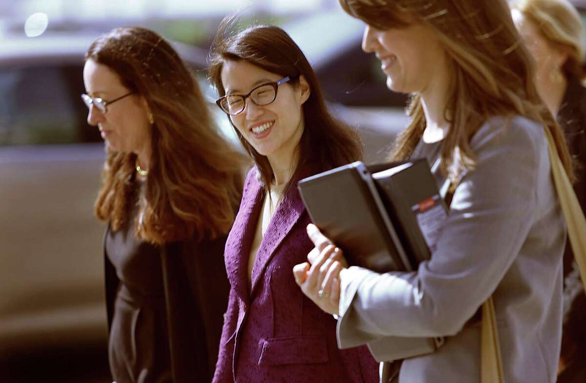 Ellen Pao, middle, takes a break with her attorneys after testifying in her lawsuit Monday in San Francisco.