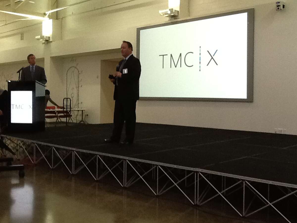 From left, William McKeon, executive vice president and chief strategy and operating office for the Texas Medical Center, listens as Marc Lee, CEO of Delafield Solutions, introduces his company at the TMC|X, the Medical Center's business accelerator.