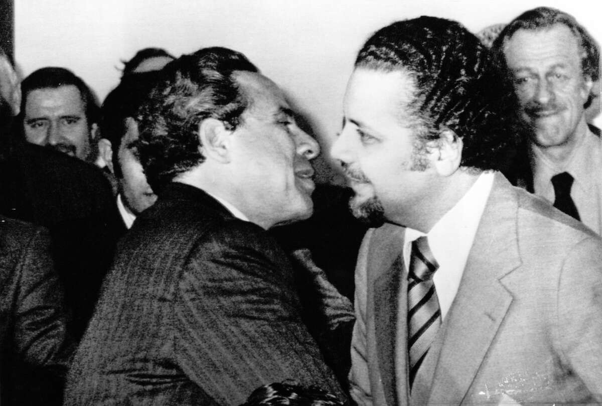 Vienna, AUSTRIA, Mar. 17, 1974 - OPEC SESSION -- Egyptian oil minister Ahmed Hillal (L) and Saudi Arabian oil minister Zaki Yamani embrace at the start of a session of the Organization of Petroleum Exporting Countries (OPEC) meeting in Vienna Sunday night, March 17, 1974. (AP Wirephoto)