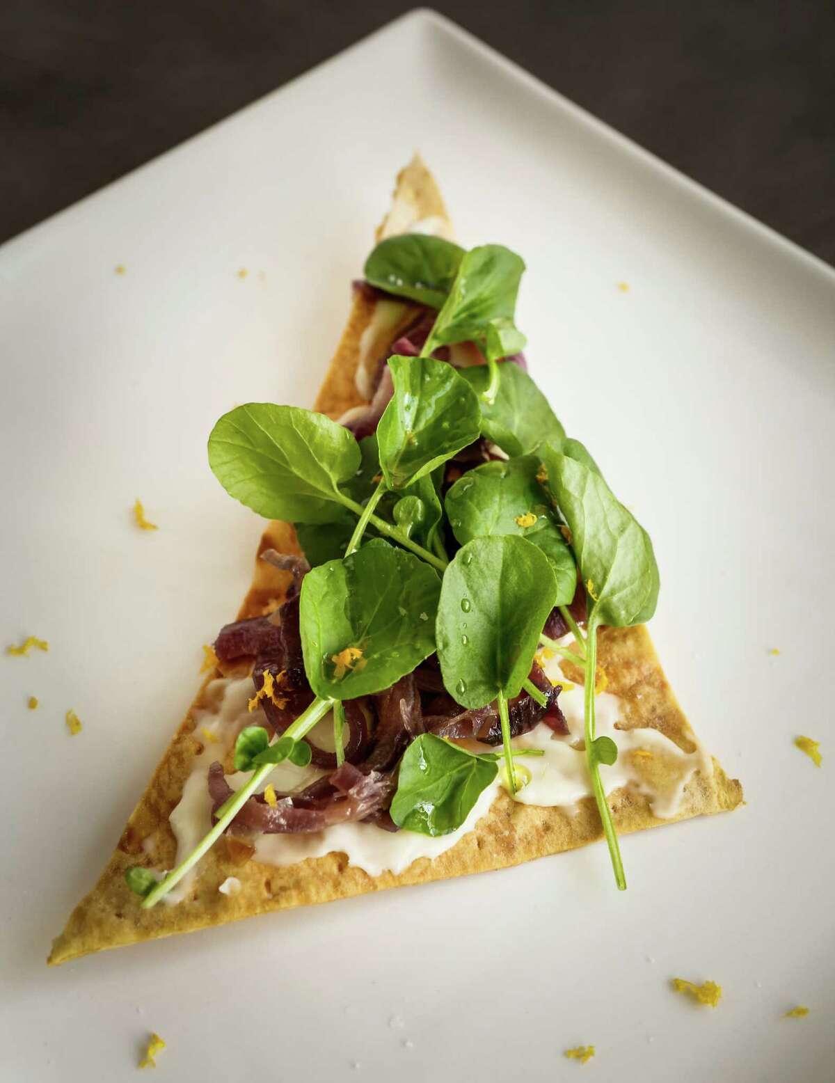 Crispy Flatbread With Watercress, Crescenza Cheese & Caramelized Red Onions.