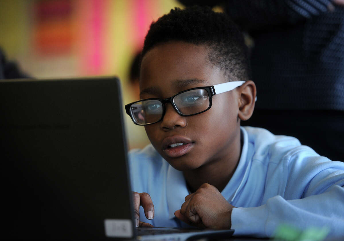Sixth grader Isreal Burton, 11, familiarizes himself with the format of the new common core standardized test, which will be taken online, at Jettie Tisdale School in Bridgeport, Conn. on Tuesday, March 10, 2015.