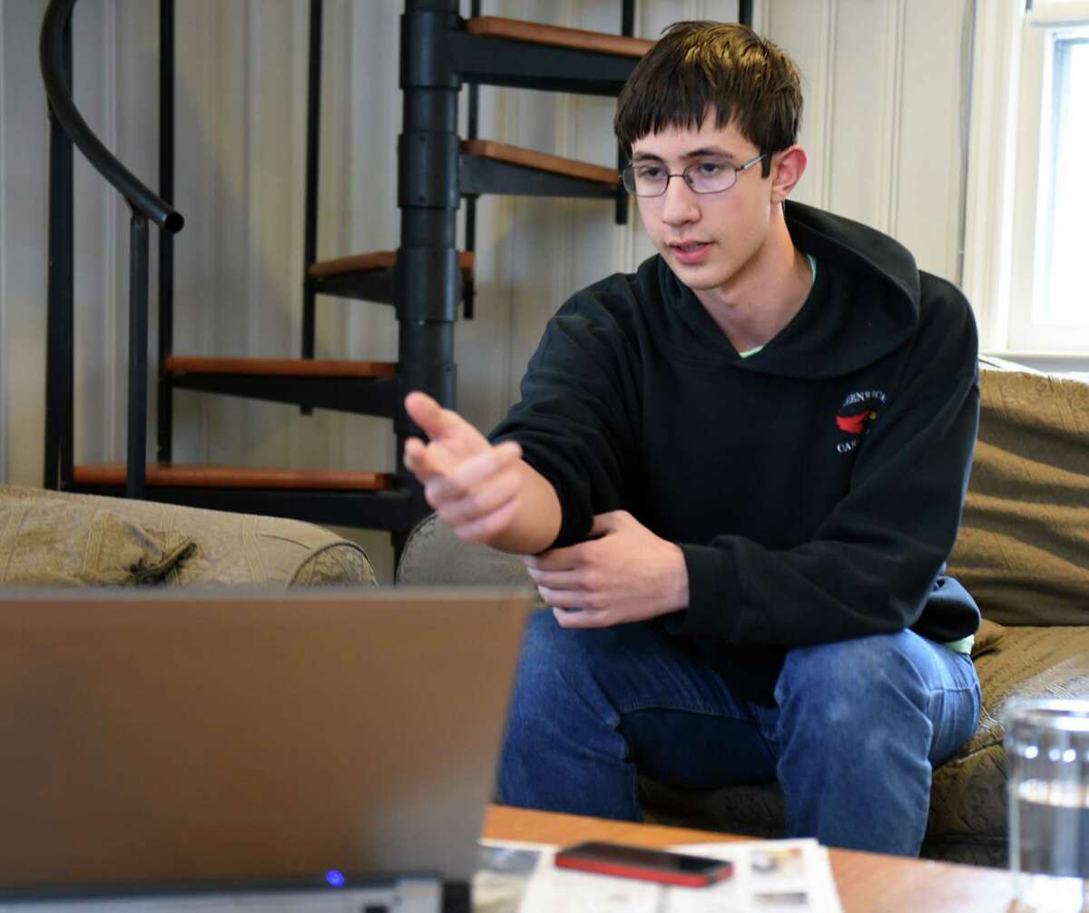 Greenwich High School junior Michael Kural explains a math problem at his home in the Riverside section of Greenwich, Conn. Tuesday, March 10, 2015. Kural was one of six American students who competed last week at the Romanian Master of Mathematics competition in Bucharest. Michael was one of only 10 students who won a gold medal at the esteemed math competition.
