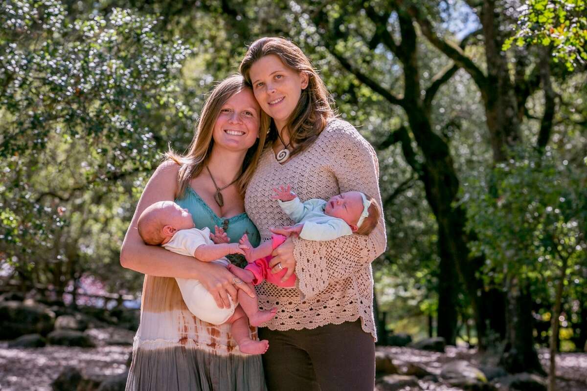 New moms Melinda and Dani Phoenix hold their babies Oliver and Ella Stein.