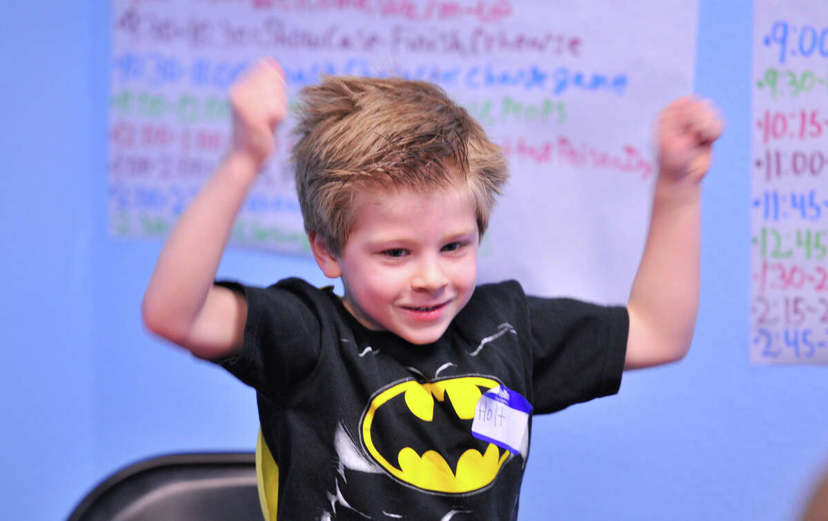 Holt Henning as Batman practices a part in the Superheroes class at the newly opened Magik Performing Arts Center near I10 and DeZavala.