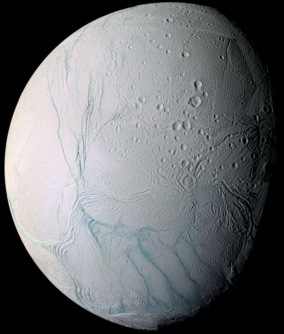 This June 28, 2009 image provided by NASA, taken by the international Cassini spacecraft, shows Enceladus, one of Saturn's moons. A new study published online Wednesday, March 11, 2015, in the journal Nature, suggests there are ongoing interactions between hot water and rocks beneath the surface of the icy moon. (AP Photo/NASA)